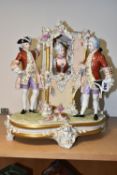 A ROYAL DUX SEDAN CHAIR FIGURE GROUP, modelled with a lady inside the sedan chair and two men and