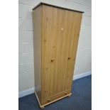 A MODERN PINE TWO DOOR WARDROBE, with a single drawer, width 82cm x depth 49cm x height 190cm (