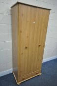 A MODERN PINE TWO DOOR WARDROBE, with a single drawer, width 82cm x depth 49cm x height 190cm (