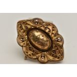 A VICTORIAN MOURNING BROOCH, yellow metal navette form brooch, decorated with beading and