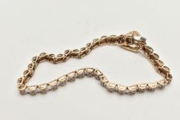 A 9CT GOLD DIAMOND LINE BRACELET, designed as a series of box links each set with a small round
