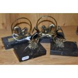 TWO PAIRS OF ART DECO BOOKENDS, comprising a near pair in the form of brass squirrels seated in