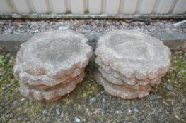 A SET OF FOURTEEN WEATHERED COMPOSITE STEPPING STONES