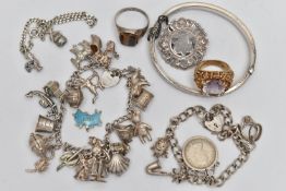 A SELECTION OF SILVER AND WHITE METAL JEWELLERY, to include three charm bracelets, a hinged