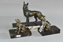 A GROUP OF ART DECO DOG FIGURES, comprising a pair of bookends with stylised gilt metal retrievers