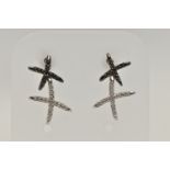 A PAIR OF 9CT GOLD DIAMOND SET EARRINGS, each designed as two crosses set with single cut black