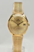 A 'DELMA OF SWITZERLAND' YELLOW METAL WRISTWATCH, automatic movement, gold tone dial signed 'Delma