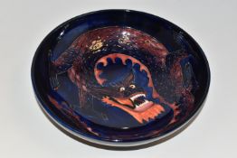 A MOORCROFT DRAGON BOWL, designed by Trevor Critchlow for Moorcroft, a bowl decorated with a red and