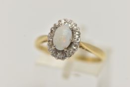 AN 18CT GOLD OPAL AND DIAMOND CLUSTER RING, oval cluster set with a central opal cabochon, in a