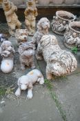 A SELECTION OF WEATHERED COMPOSITE GARDEN FIGURES, that's including a various breed of dogs (