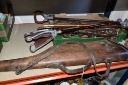 ONE BOX OF BRIDLE HAMES, BRASSES AND WALKING STICKS, to include a leather leg-of-mutton gun case
