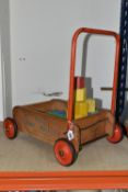 A TRIANG BABY WALKER, with thirty two coloured blocks, height 50cm (1) (Condition Report: wheels and