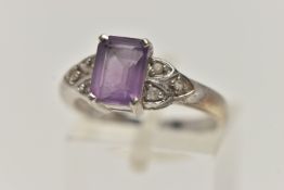 A 9CT WHITE GOLD AMETHYST AND SPINEL RING, set with a rectangular cut amethyst, four claw set,