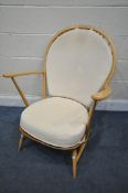 AN ERCOL MODEL 317 ELM AND BEECH GRANDFATHER CHAIR, with cream loose cushions (condition report: -