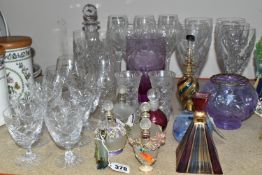 A GROUP OF CUT CRYSTAL AND COLOURED GLASS, comprising eight Royal Doulton red wine glasses, three