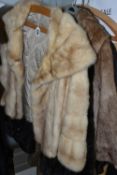 FOUR JACKETS AND ONE BOX, comprising a dark brown 'Astraka' faux fur, a blonde mink fur evening