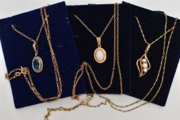 THREE GEM SET NECKLACES, the first an oval cut topaz, collet set in yellow gold with rope surround