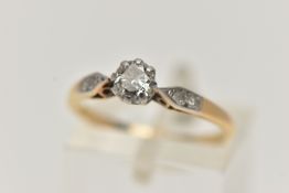 A YELLOW METAL DIAMOND RING, designed with a round brilliant cut diamond, claw set in a white