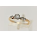 A YELLOW METAL DIAMOND RING, designed with a round brilliant cut diamond, claw set in a white