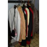 A GROUP OF SIXTEEN PIECES OF VINTAGE CLOTHING, comprising two light brown real sheepskin jackets, an