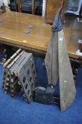 A VINTAGE HARVESTING TOOL, along with two hinged wine bottle racks, and a pine reeves artist