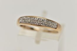 A 9CT GOLD DIAMOND SET RING, designed as a row of seven single cut diamonds to the plain tapered