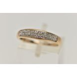 A 9CT GOLD DIAMOND SET RING, designed as a row of seven single cut diamonds to the plain tapered