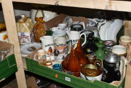 FOUR BOXES AND LOOSE CERAMICS AND GLASS WARES, to include advertising jugs, flasks and steins for