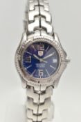 A BOXED 'TAG HEUER' WRISTWATCH, round blue dial signed 'Tag Heuer Chronometer Officially Certified