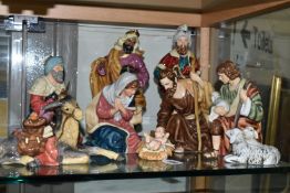 A PORCELAIN NATIVITY SET, unmarked, comprising the three Kings, Mary and Joseph, a shepherd and