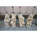 A SET OF FOUR COMPOSITE GARDEN FIGURES, of pigs playing various instruments (condition report: -