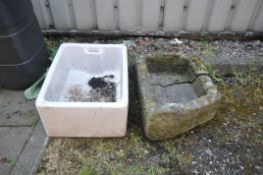 AN ANTIQUE WEATHERED SANDSTONE TROUGH, length 61cm x width 43cm x height 44cm, along with a
