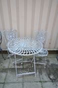 AN ALUMINIUM FOLDING GARDEN TABLE, diameter 71cm x height 79cm, and two chairs (condition report: -
