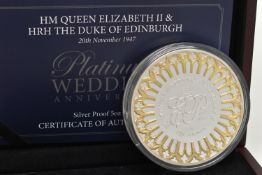 A PLATINUM WEDDING ANNIVERSARY SILVER PROOF 5OZ COIN, encased in a plastic capsule, together with