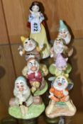 EIGHT ROYAL DOULTON SNOW WHITE AND THE SEVEN DWARFS, comprising SW 9 'Snow White', SW 10 'Doc', SW