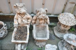 TWO WEATHERED COMPOSITE FIGURAL GARDEN PLANTERS, of a Badge and an English bulldog (condition
