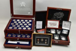 A BOXED DISPLAY OF AMERICAN SILVER DOLLAR COINS, to include five different finishes genuine