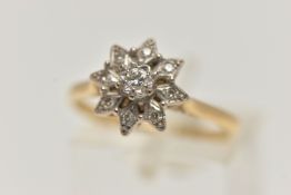 A DIAMOND CLUSTER RING, the central brilliant cut diamond in a star setting within a tiered single