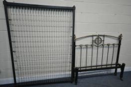 A VICTORIAN CAST IRON 4FT BEDSTEAD, with a central circular ribbon decoration to headboard (