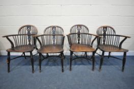 FOUR LATE 18TH/EARLY 19TH CENTURY YEW WOOD WINDSOR ARMCHAIRS, the hoop back supporting spindles