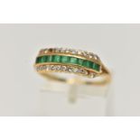 AN 18CT GOLD EMERALD AND DIAMOND RING, designed as a central line of nine square cut emeralds with a