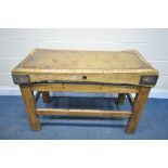 AN ANTIQUE RECTANGULAR BUTCHERS BLOCK, with iron corners, on a pine stretchered base, length 122cm x