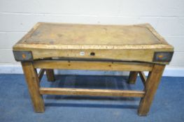 AN ANTIQUE RECTANGULAR BUTCHERS BLOCK, with iron corners, on a pine stretchered base, length 122cm x