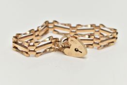 A 9CT GOLD GATE BRACELET, a yellow gold three bar gate bracelet, fitted with a heart padlock