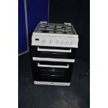 A VALOR GAS COOKER with four top burners, oven and grill width 60cm x depth 67cm x height 94cm (