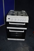 A VALOR GAS COOKER with four top burners, oven and grill width 60cm x depth 67cm x height 94cm (
