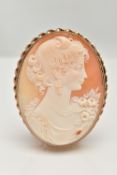 A 9CT GOLD CAMEO BROOCH, large oval brooch, carved shell cameo depicting a lady in profile, collet