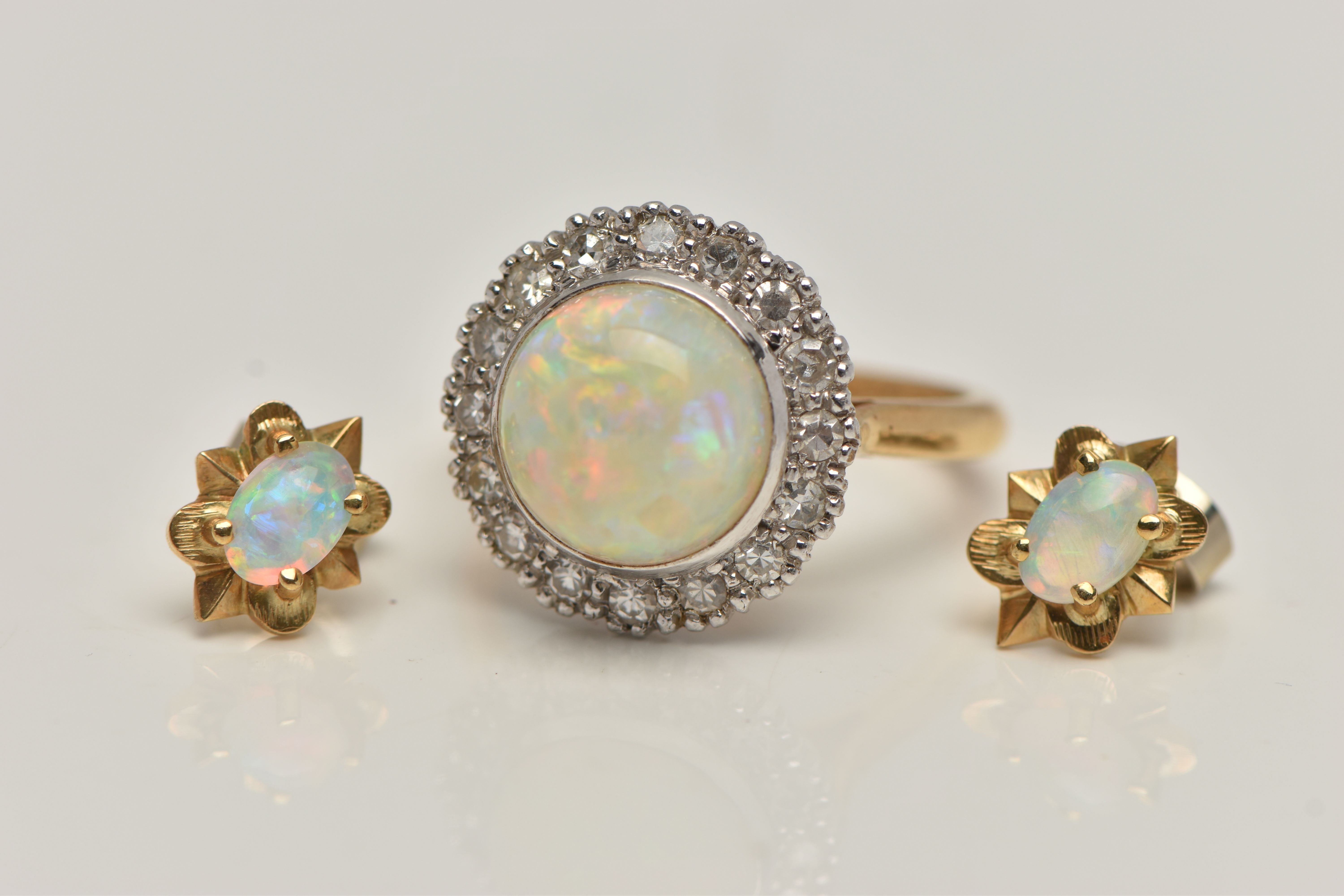 AN 18CT GOLD OPAL AND DIAMOND RING AND A PAIR OF OPAL EARRINGS, the ring of a circular form, set