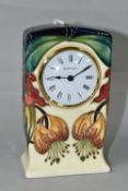 NICOLA SLANEY FOR MOORCROFT, a mantel clock decorated in the 'Anna Lily' pattern, height 15cm (5) (