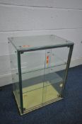 A TABLE TOP GLAZED DISPLAY CABINET, with two glass shelves, labelled seal brand product, width